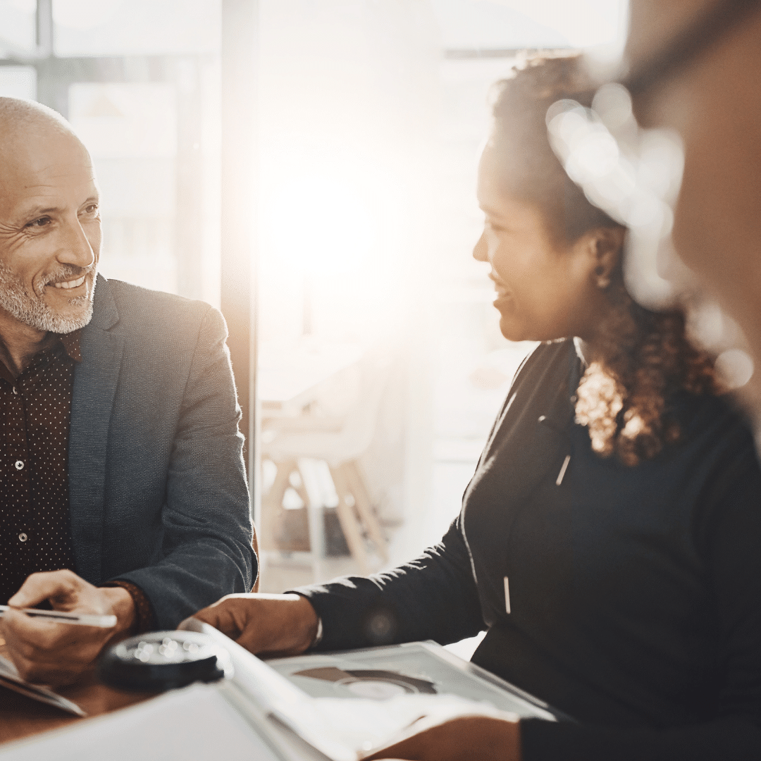A bookkeeper meeting with real estate investor clients.
