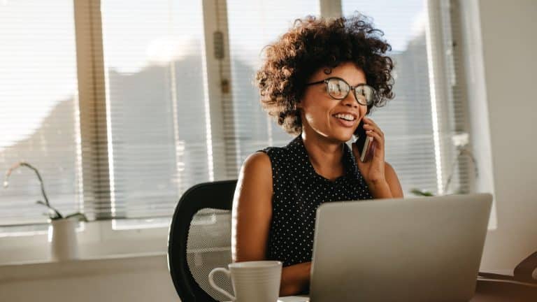 A business professional on a call with their bookkeeper.