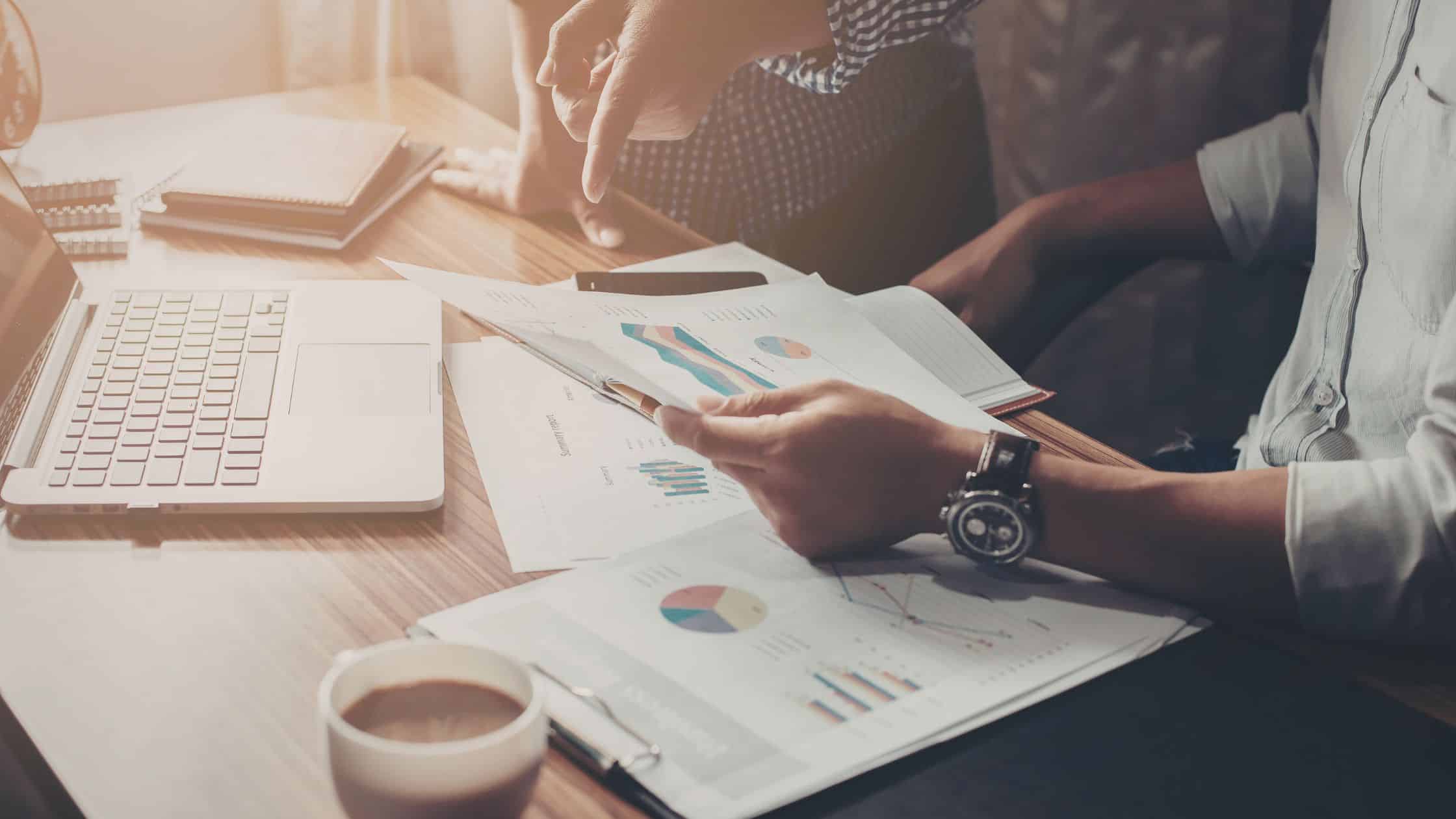 Two people discussing financial documents.