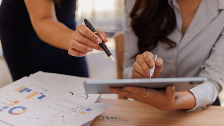 A financial advisor and client discussing the numbers.